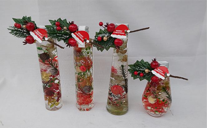 サンタの帽子つきのクリスマスハーバリウムと赤を基調とした迎春ハーバリウム　Lサイズおまかせ2本セット ｜ インテリア 植物 お花 お正月 イベント 冬 鮮やか 鑑賞 手入れ不要 ガラス 癒し ※離島への配送不可 ※2025年12月中旬～12月下旬頃に順次発送予定